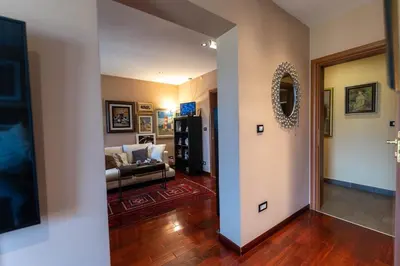 a living room with a couch and a mirror at Andrej home in Šušunja