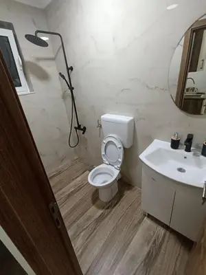 a bathroom with a toilet and a sink at ApartmentsMD apartman 1 za pravi odmor in Sutomore