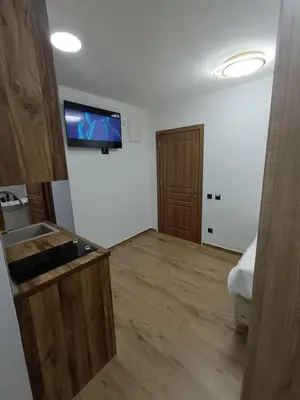 a living room with a television on the wall at ApartmentsMD apartman 1 za pravi odmor in Sutomore