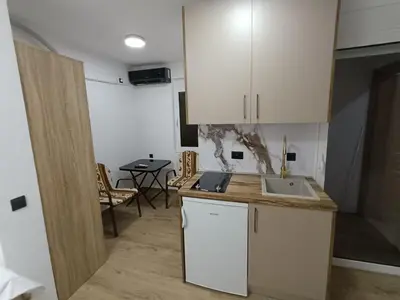 a kitchen with a sink and a counter top at ApartmentsMD apartman 1 za pravi odmor in Sutomore