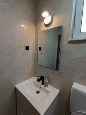 a bathroom with a sink and a mirror and a toilet at ApartmentsMD apartment 3 for real enjoyment in Sutomore