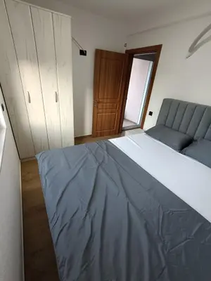 a bedroom with a large bed and a couch at ApartmentsMD apartment 3 for real enjoyment in Sutomore