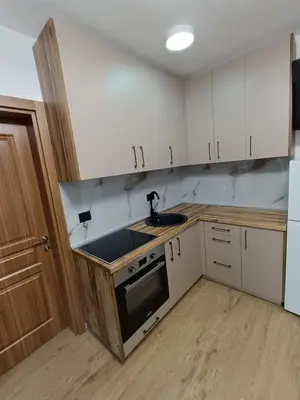 a kitchen with white cabinets and a sink at ApartmentsMD apartment 3 for real enjoyment in Sutomore
