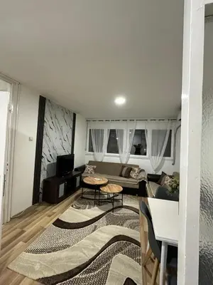 a living room with a couch and a table at Zagi Apartment in Ulcinj