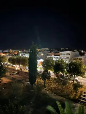 a view of a city at night at Zagi Apartment in Ulcinj