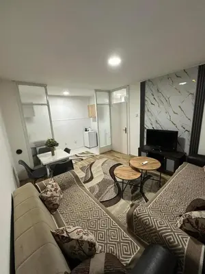 a living room with a couch and a table at Zagi Apartment in Ulcinj