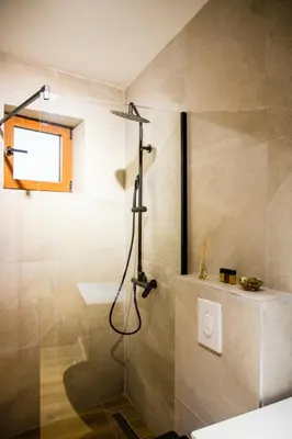 a bathroom with a shower with a glass door at Villa Terra Promessa in Ulcinj