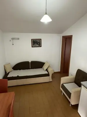 a room with a bed and a couch and a chair at Atlantic-Moj market in Boreti