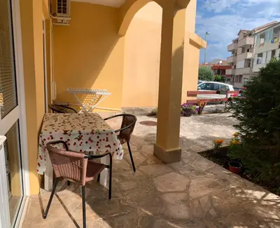 a table and chairs sitting on a patio at Villa Nova in Budva