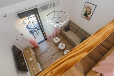 an overhead view of a living room with a couch at Monte Bay Apartments in Kotor