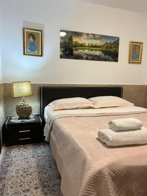 a bedroom with two beds and a table with a lamp at Teuta Azure Apartment - Blue Horizont Complex, Sveti Stefan in Pržno