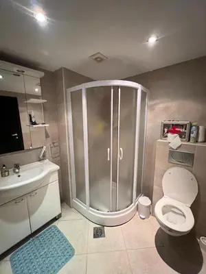 a bathroom with a shower and a toilet and a sink at Teuta Azure Apartment - Blue Horizont Complex, Sveti Stefan in Pržno
