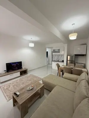 a living room with a couch and a table at FB Apartments in Ulcinj