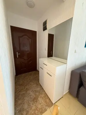 a room with a white cabinet and a door at Mila apartman in Budva