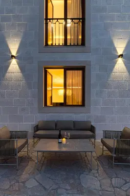 a room with a couch and two chairs and a table at Villa 53 in Lapčići