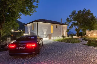 a car parked in front of a house at Villa 53 in Lapčići