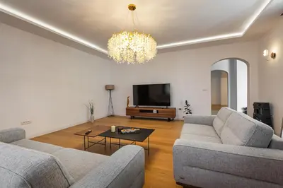 a living room with two couches and a television at Villa 53 in Lapčići