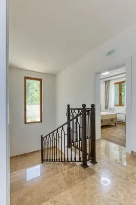 an empty room with a staircase in a house at Villa 53 in Lapčići