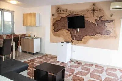 a living room with a map on the wall at Old Olive Tree Apartment in Bar