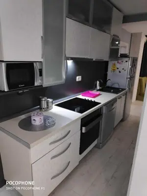 a kitchen with a stove and a counter top at Apart102 in Budva