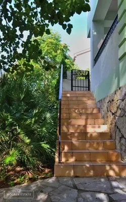 a set of stairs leading up to a building at Квартира - Солнце in Budva