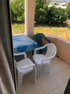 a table and two chairs and a table and chairs on a balcony at Apartments Yrhan in Ulcinj