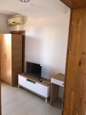 a room with a desk with a tv on it at Apartments Yrhan in Ulcinj