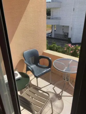 a patio with a table and chairs and a table and a chair at Apartments Yrhan in Ulcinj