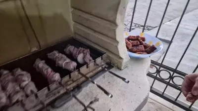 a grill with meat and a bowl of food at Sunset Villa in Bar