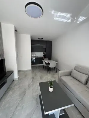 a living room with a couch and a table at Mona in Ulcinj