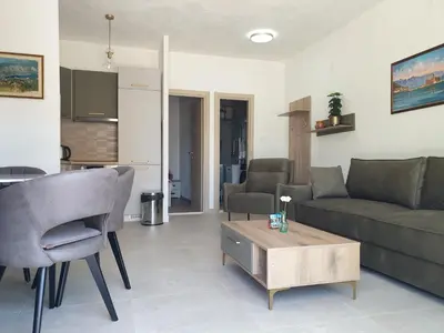 a living room with a couch and a table at Apartment Serenity Nest in Kotor