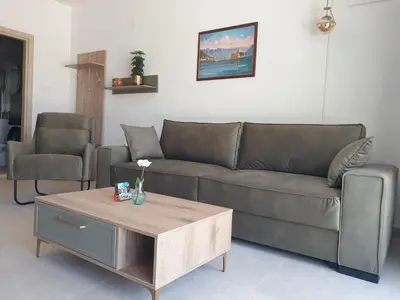 a living room with a couch and a coffee table at Apartment Serenity Nest in Kotor