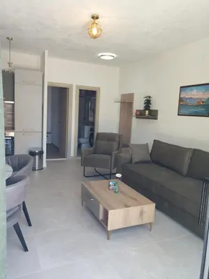 a living room with a couch and a coffee table at Apartment Serenity Nest in Kotor
