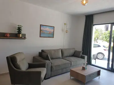 a living room with a couch and a table at Apartment Serenity Nest in Kotor