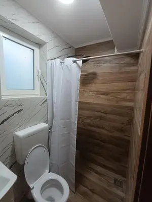 a bathroom with a toilet and a shower at ApartmaniMD apartman 5 uzivanje na pravom mjestu in Sutomore