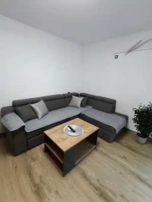 a living room with a couch and a coffee table at ApartmaniMD apartman 5 uzivanje na pravom mjestu in Sutomore