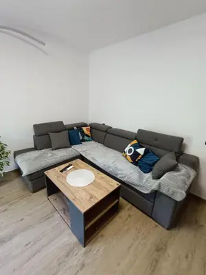 a living room with a couch and a table at ApartmentsMD apartman 6 najlepse sto zivot pruza in Sutomore