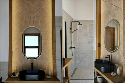 a bathroom with a black sink and a mirror at High-End Villa with Private Beach Access in Brca