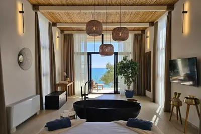 a bathroom with a large tub in a room with a view at High-End Villa with Private Beach Access in Brca