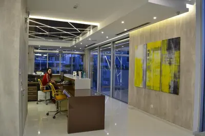 a woman sitting at a desk in an office at Perla Luxury in Ulcinj