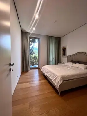a bedroom with a bed and a large window at Dukley Retreat, Serenity Collection in Budva