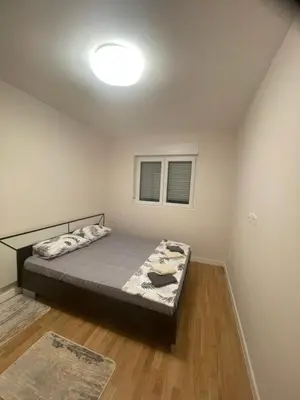 a bedroom with a bed in a room at Alex 2210 in Podgorica