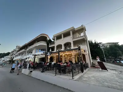 a group of people standing outside of a building at Pansion Aksa in Ulcinj