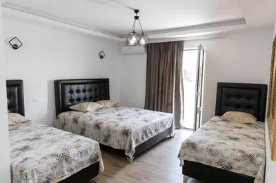 a hotel room with two beds and a window at Apartments Ceka in Ulcinj