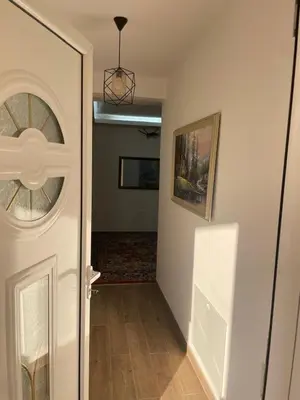 a hallway with a white door and a hallway with a room at Apartments Ceka in Ulcinj