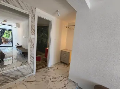 a bathroom with a mirror and a sink in a room at Villa vista mare in Zagrađe