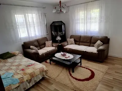 a living room with a couch and a coffee table at Kuća Duskic in Kunje