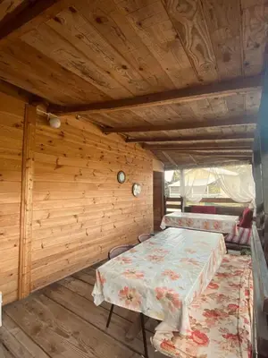 a room with two beds and a table in it at Sunrise in Ulcinj
