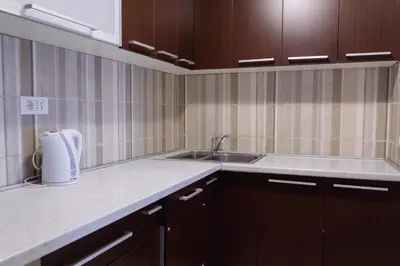 a kitchen with a sink and a counter top at Sea View Retreat with Pool in Bar