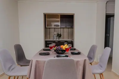 a table with chairs and a bowl of fruit on it at Sea View Retreat with Pool in Bar